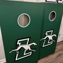Custom painted cornhole boards with team logo — personalized woodwork by Two Mittens